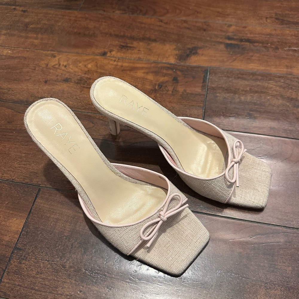 RAYE Women's Cream Heeled Mules with Bow Accent